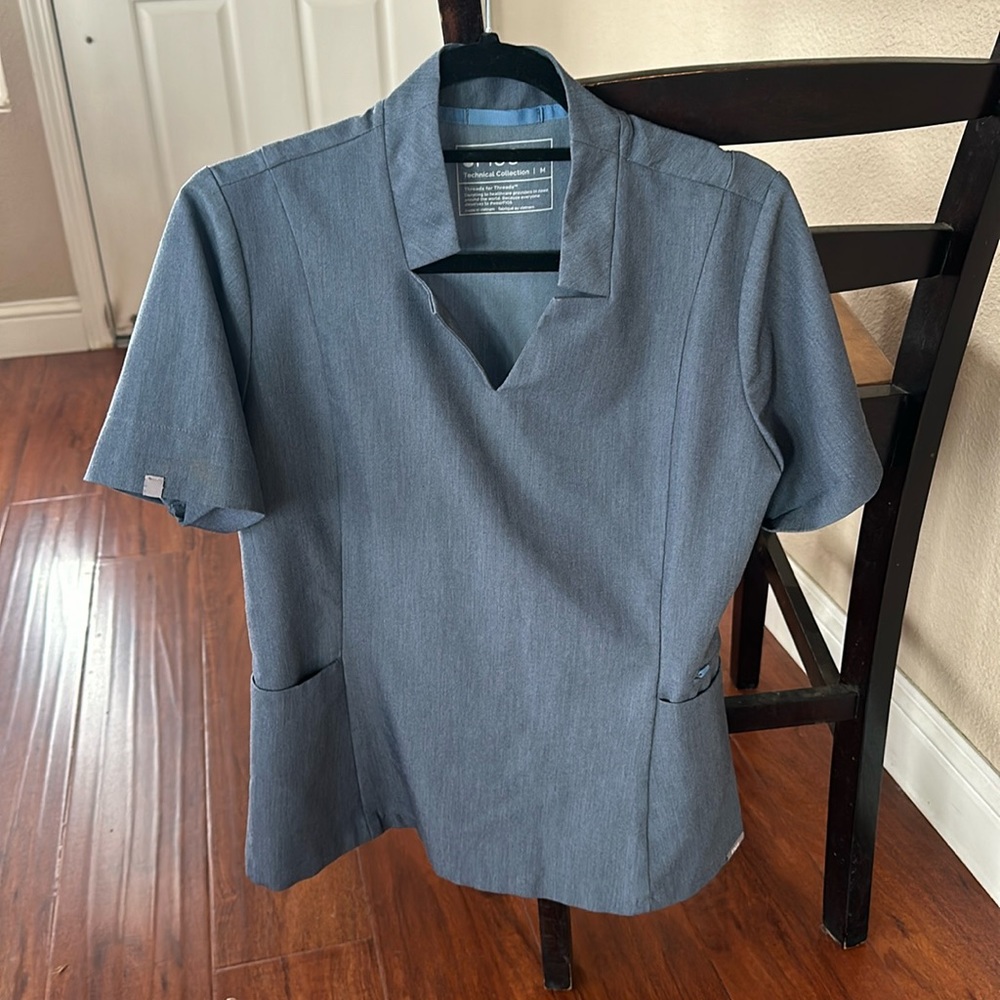 Over sized style. Actual color heather grey.   Has grey bluish color too it